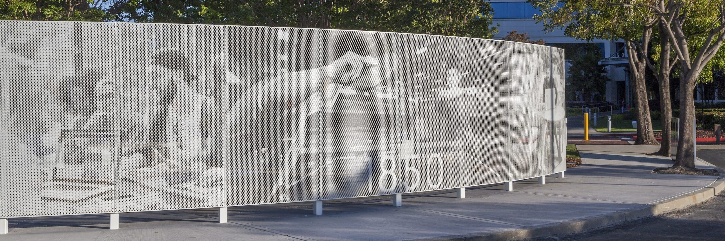 Curved free-standing ImageWall screen in painted aluminum for 1850 Gateway Courtyard.