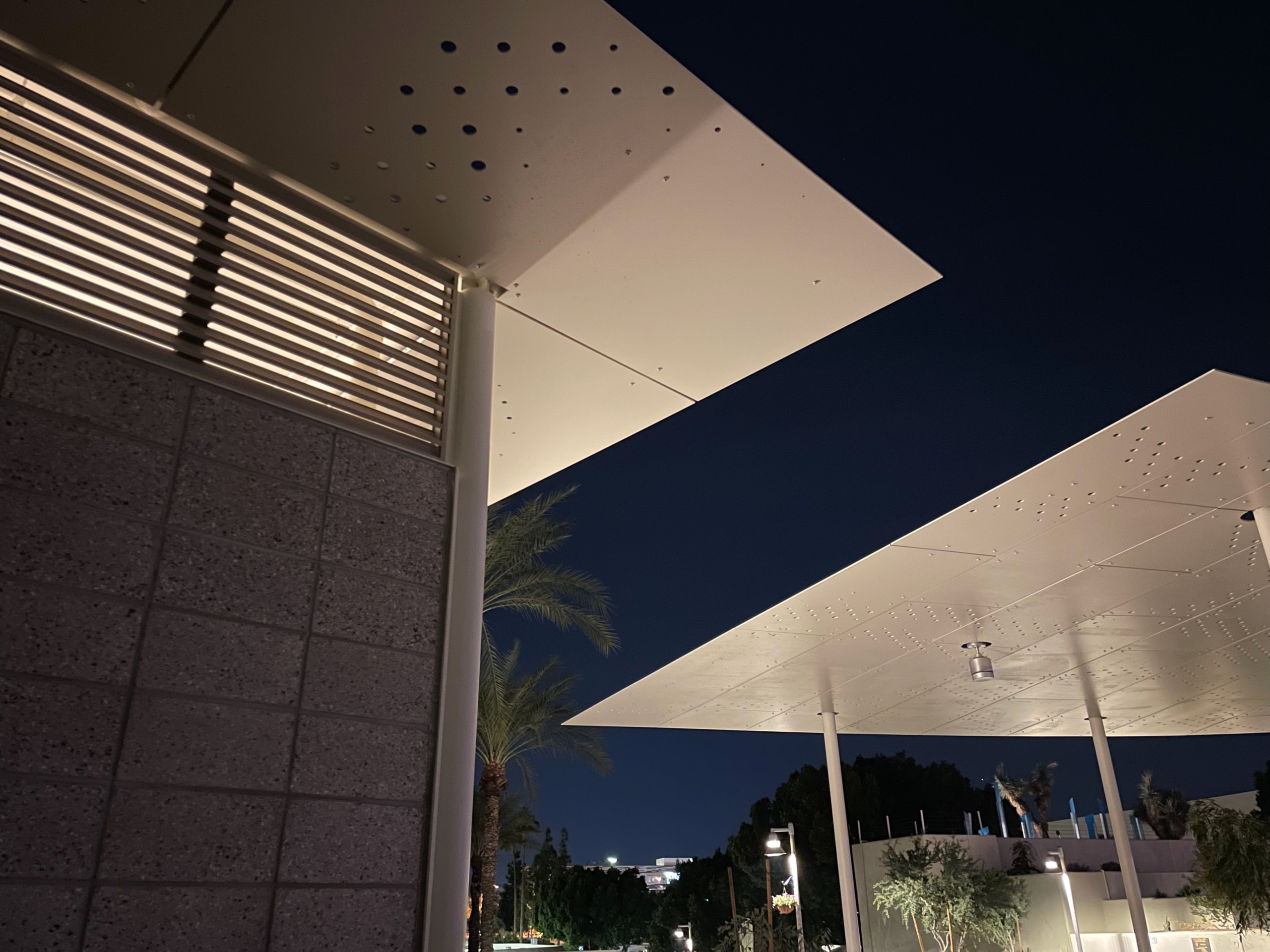 Eaves made of the same panel material as the pavilions creates an cohesive aesthetic.