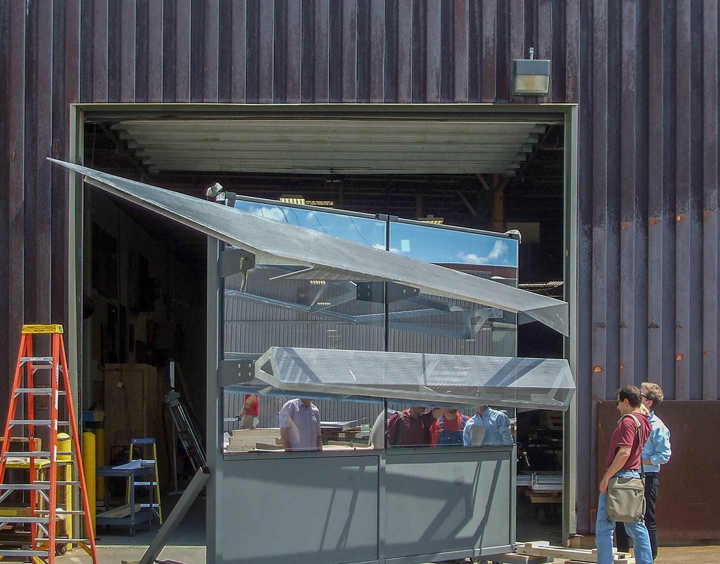 The design team members examine the Zahner mockup as part of the Design Assist contract.