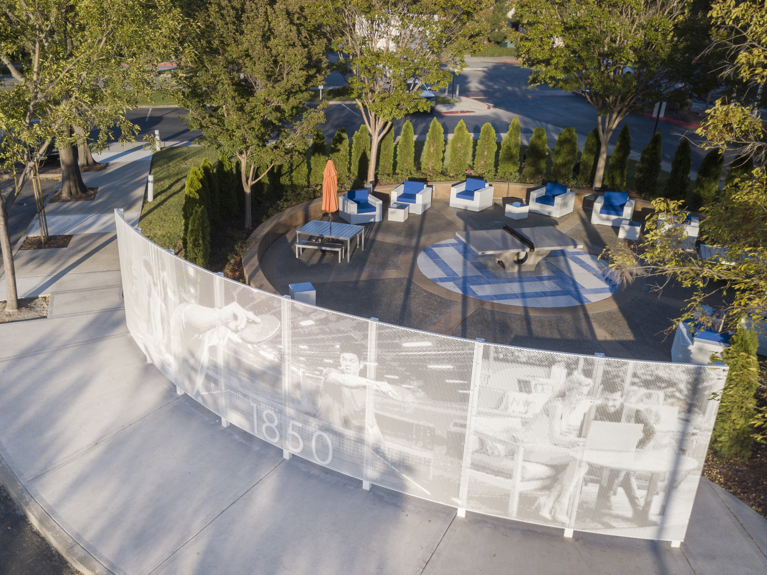 Curved free-standing ImageWall screen in painted aluminum for 1850 Gateway Courtyard.