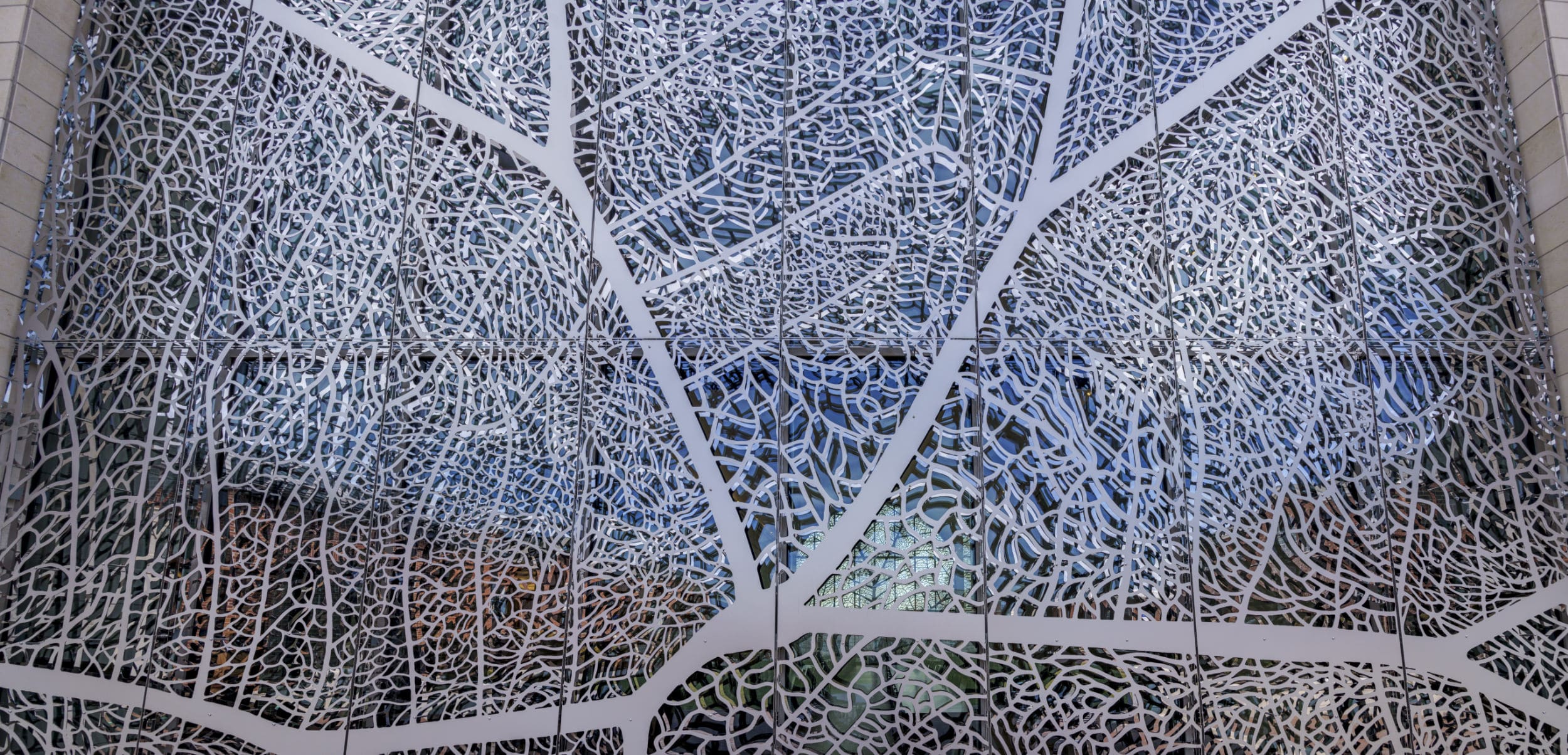 Close-up view of the stainless steel screen system, showing the dual layers of screens.