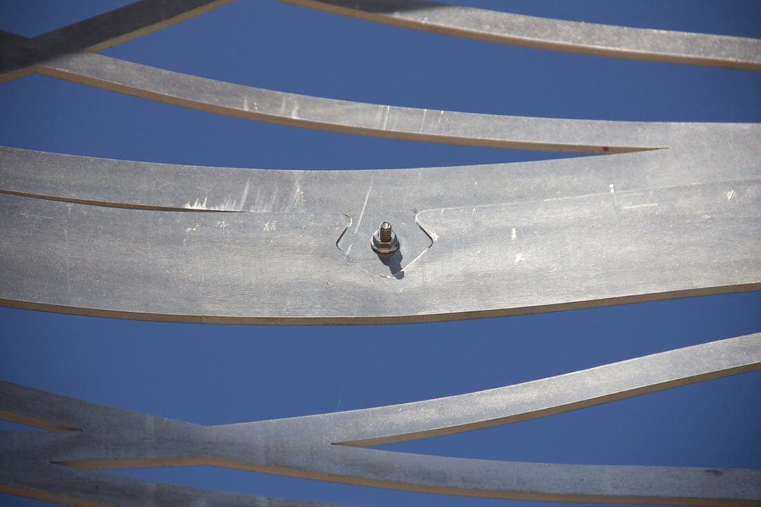 Details shows the custom milled interlocking metalwork on the facade-testing tower.