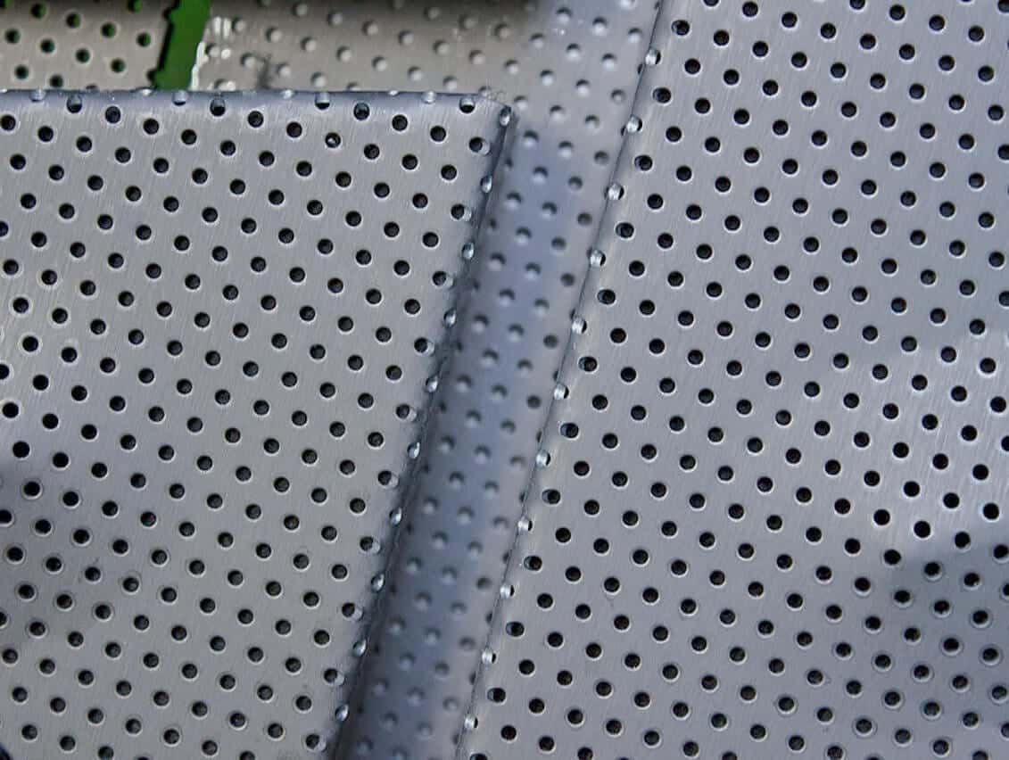 Detail of the punched and custom-embossed zinc acoustic panels at KCPD Headquarters.