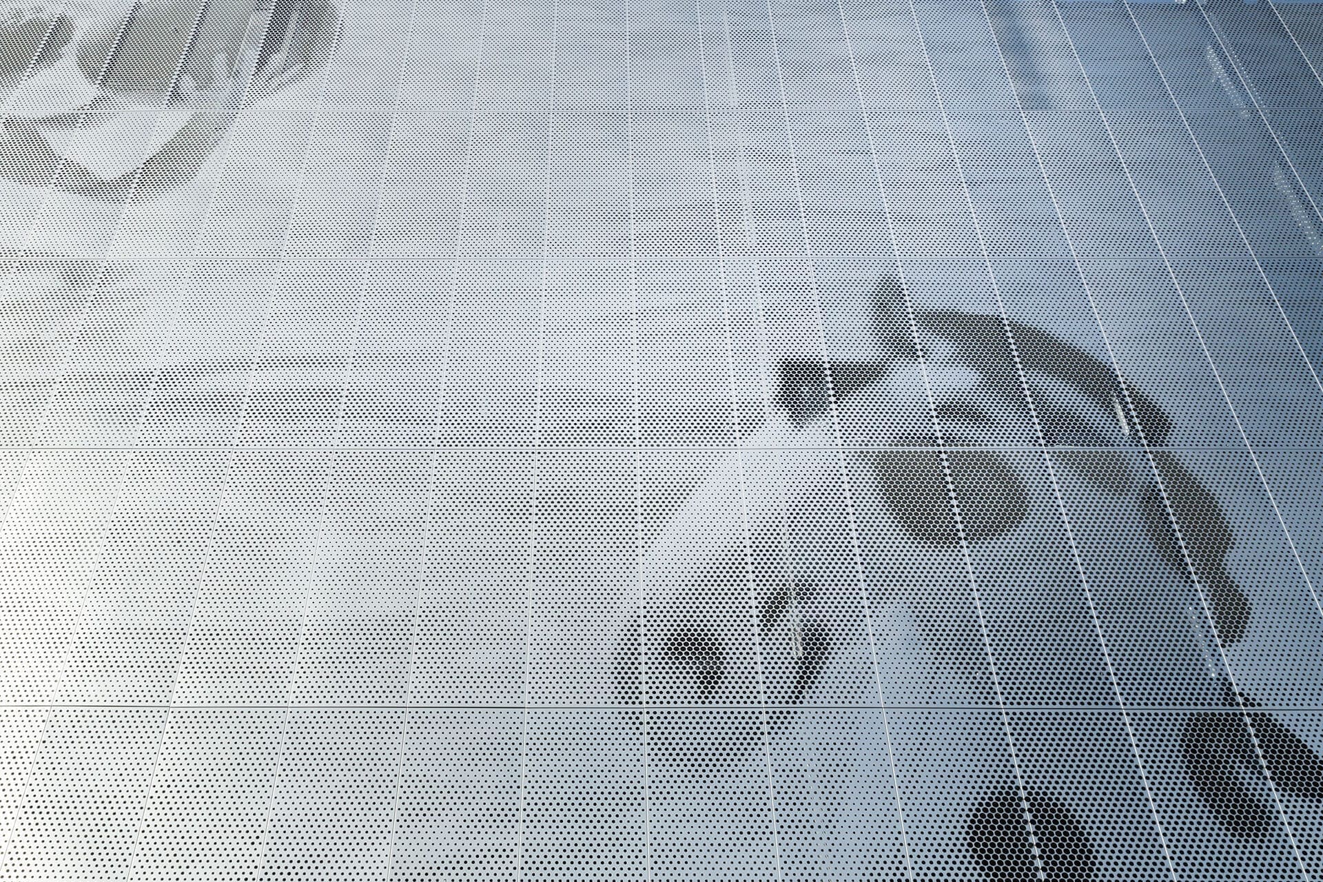 Parking garage facade designed by artist John Baldessari using ImageWall and Angel Hair Stainless Steel.