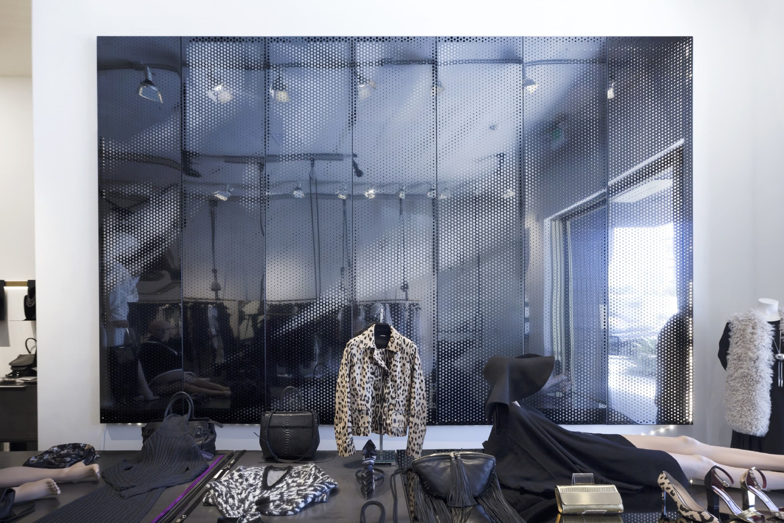 Gambucci Boutique feature wall with black Interference Stainless Steel with a mirror polish.