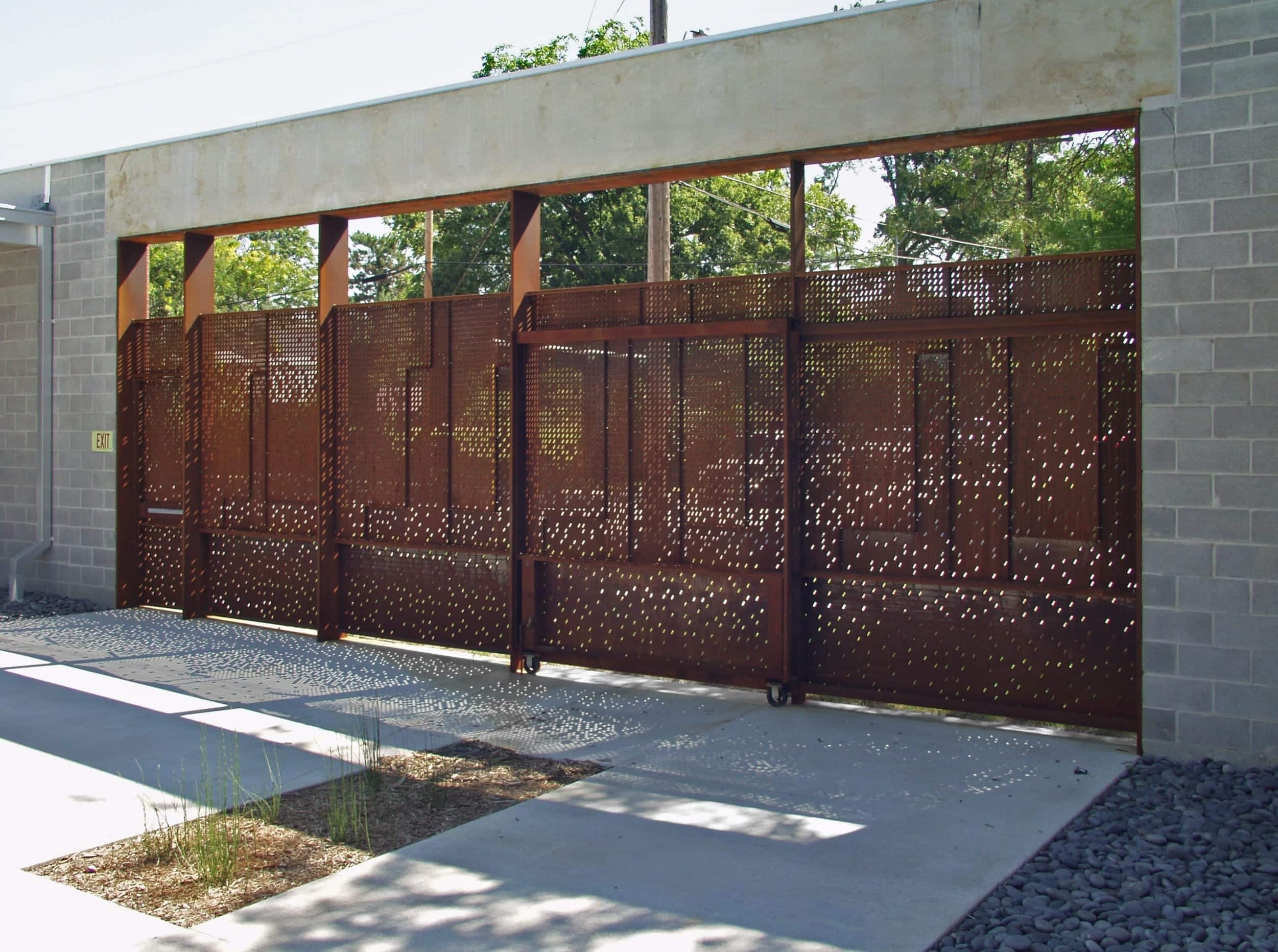 Light enters the space through the custom perforated steel for the Irving Courtyard screenwall at KCAI.