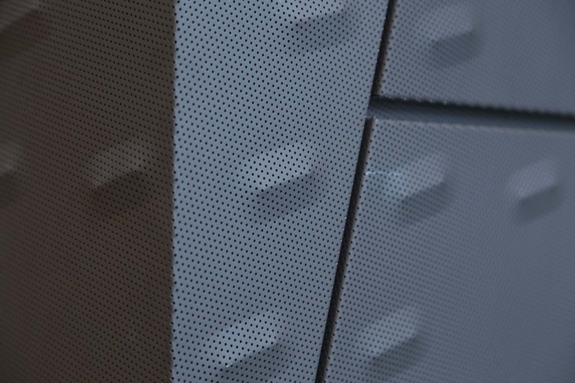 Detail of the punched and custom-embossed zinc acoustic panels at KCPD Headquarters.