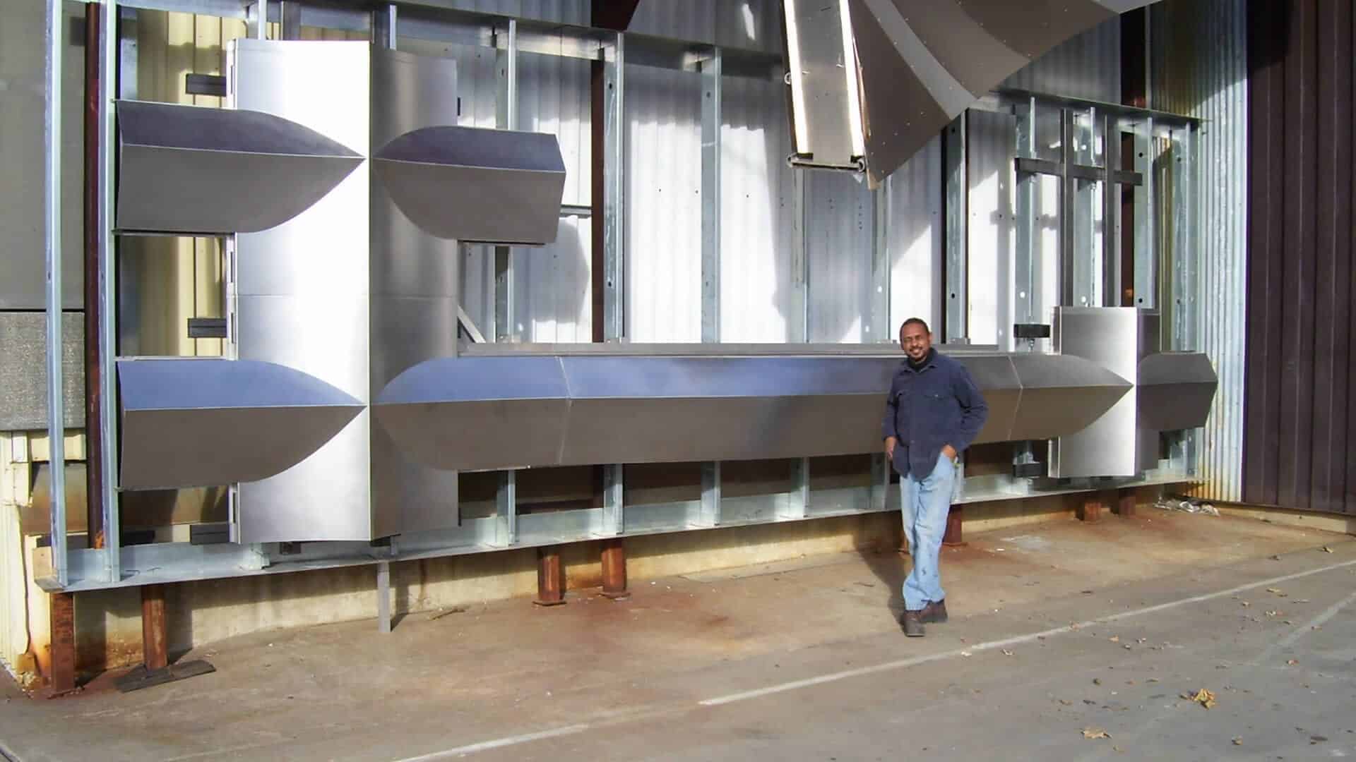 Zahner welder Kerry Butler with the 200 Eleventh mockup at the Kansas City factory.