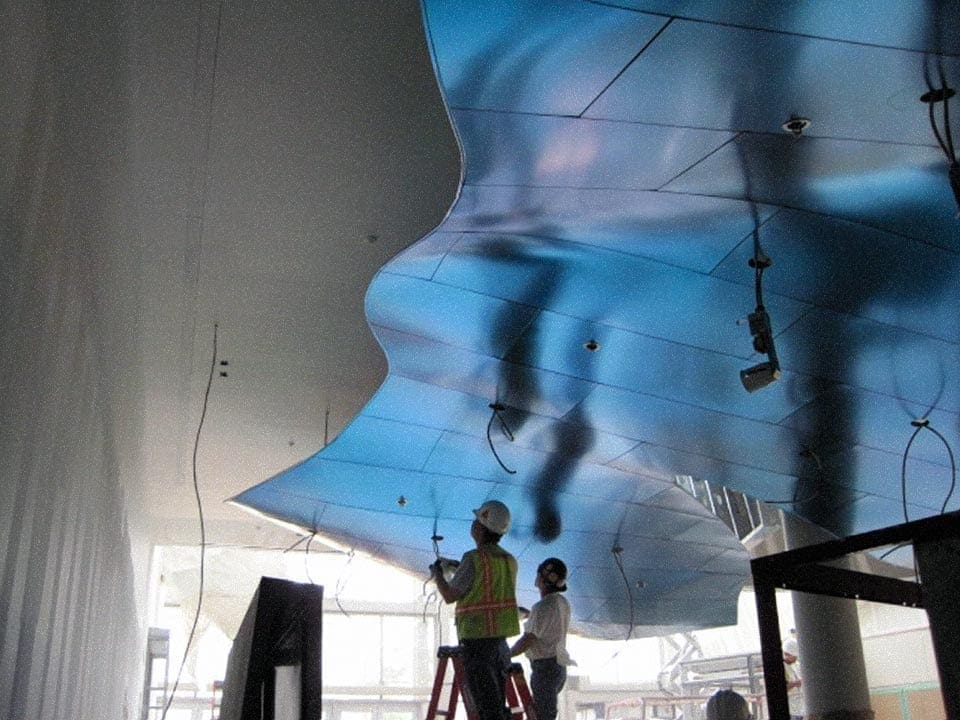 Zahner installers ensure the wiring is prepared for light fixtures.