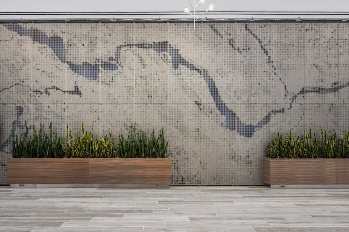 An interior perforated panel feature wall designed by BH Architects in collaboration with Zahner.