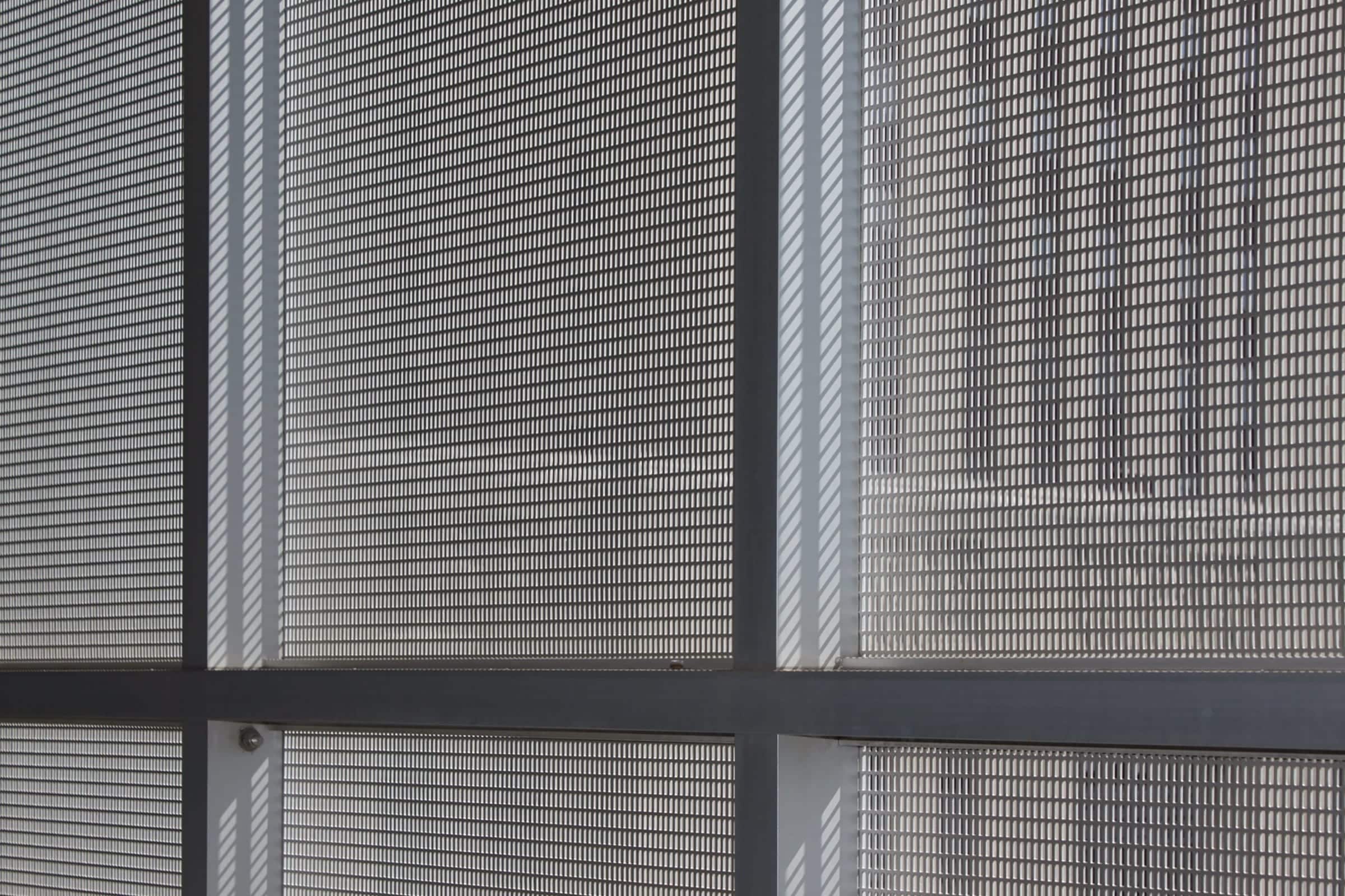 Interior mullion attachment for the perforated metal aluminum panels.