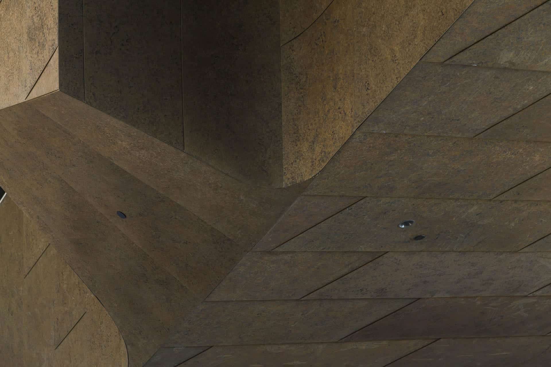 Detailed metalwork uses Zahner's preweathered custom zinc patina.