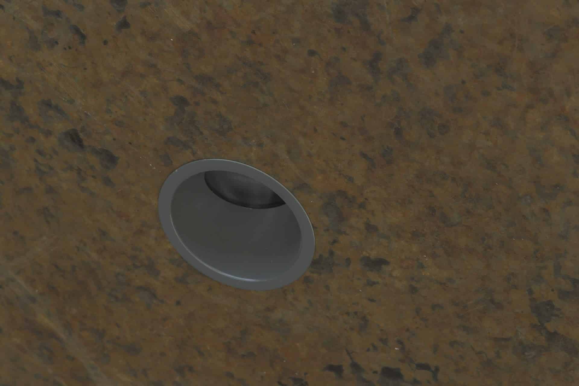 Detail of the zinc ceiling soffit and recessed lighting.