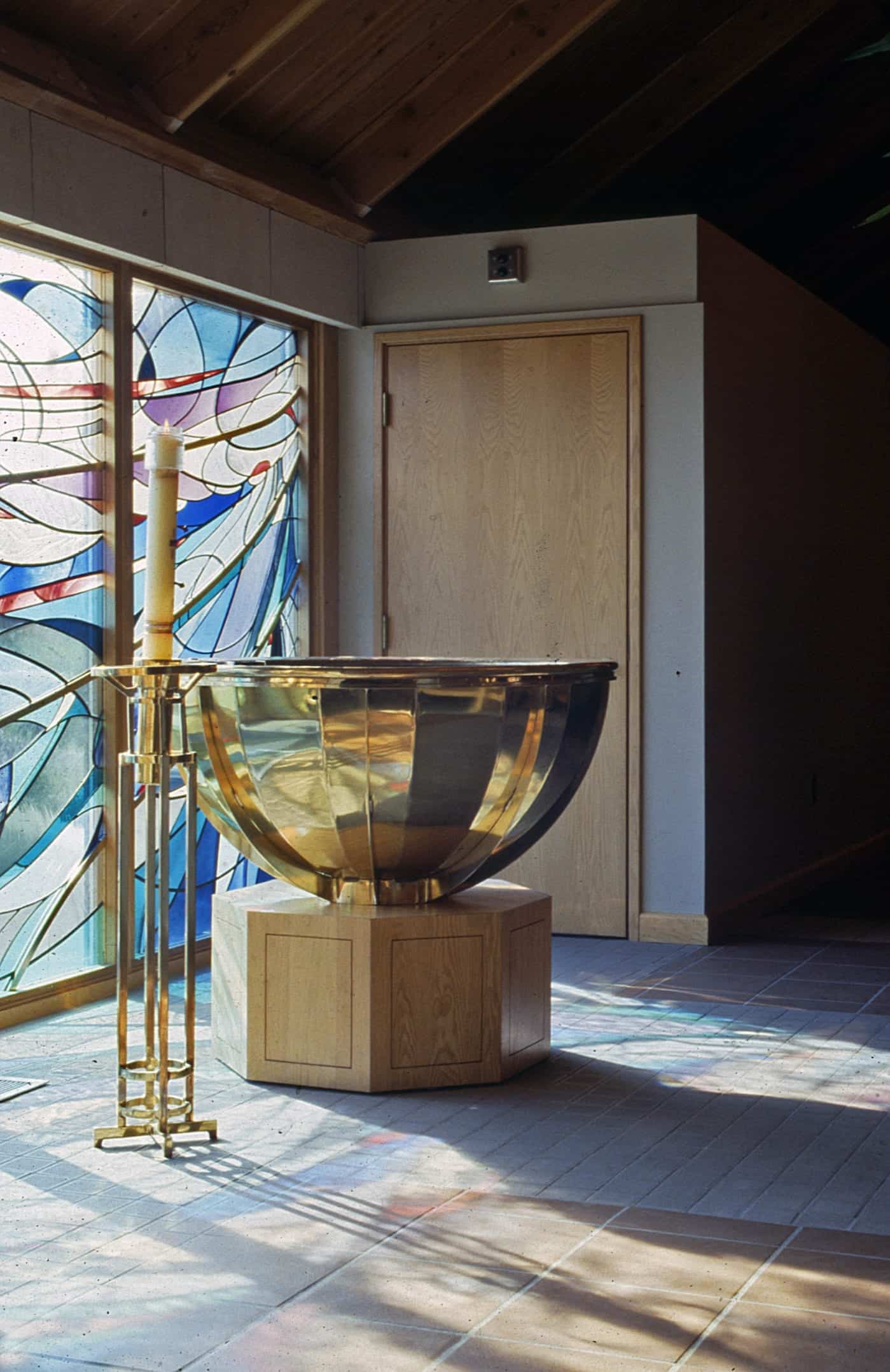 Detail of the inlaid brass used on the stained glass, custom brass altar and candle holders