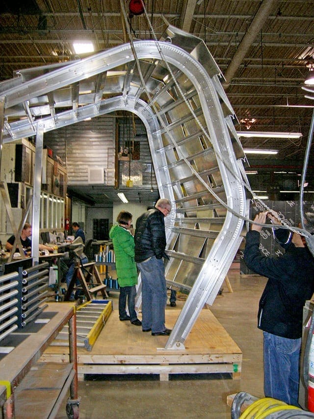 Architects from Daly Genik examine the mockup at Zahner.