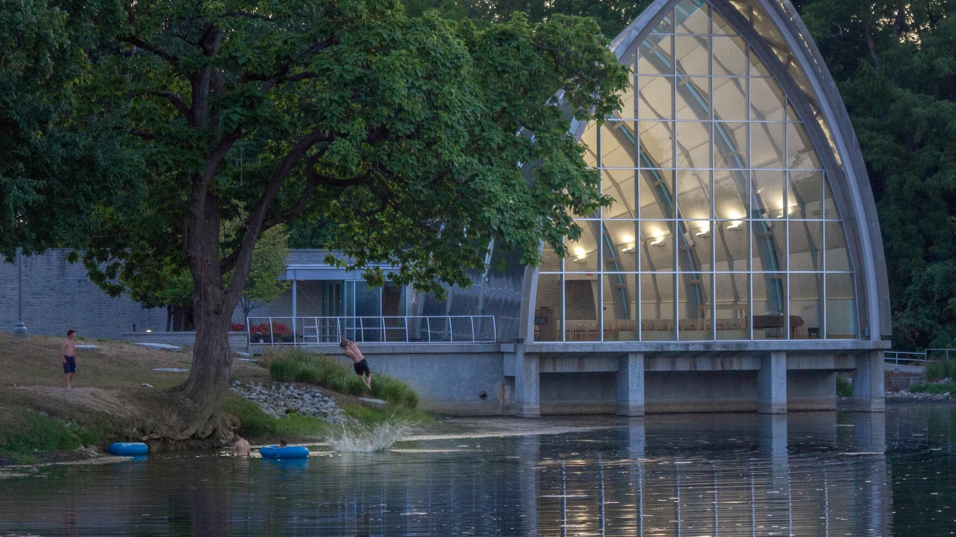 Students dive in the lake in front of the chapel at Rose-Hulman.