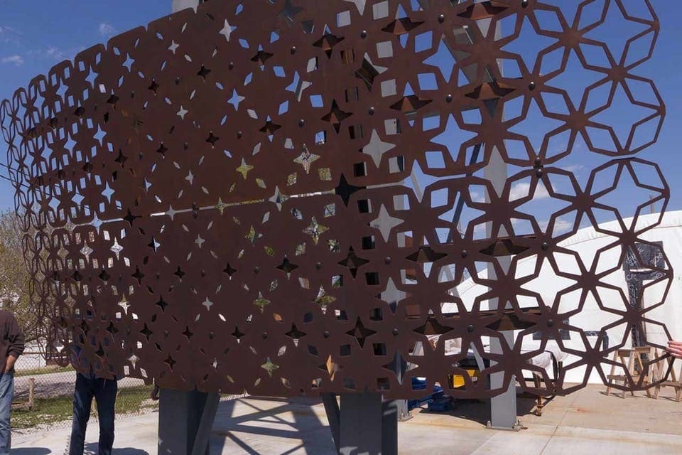 Finished patinated Solanum Steel plate panels hung.