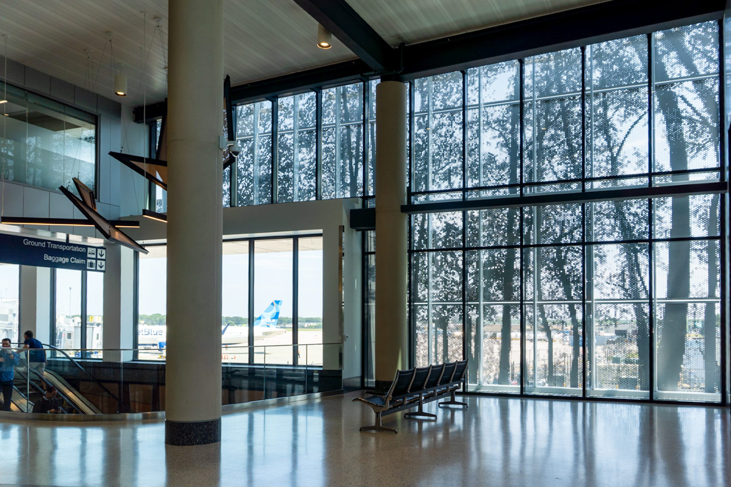 The ImageWall facade at Bradley International Airport depicts a stylized forest landscape.