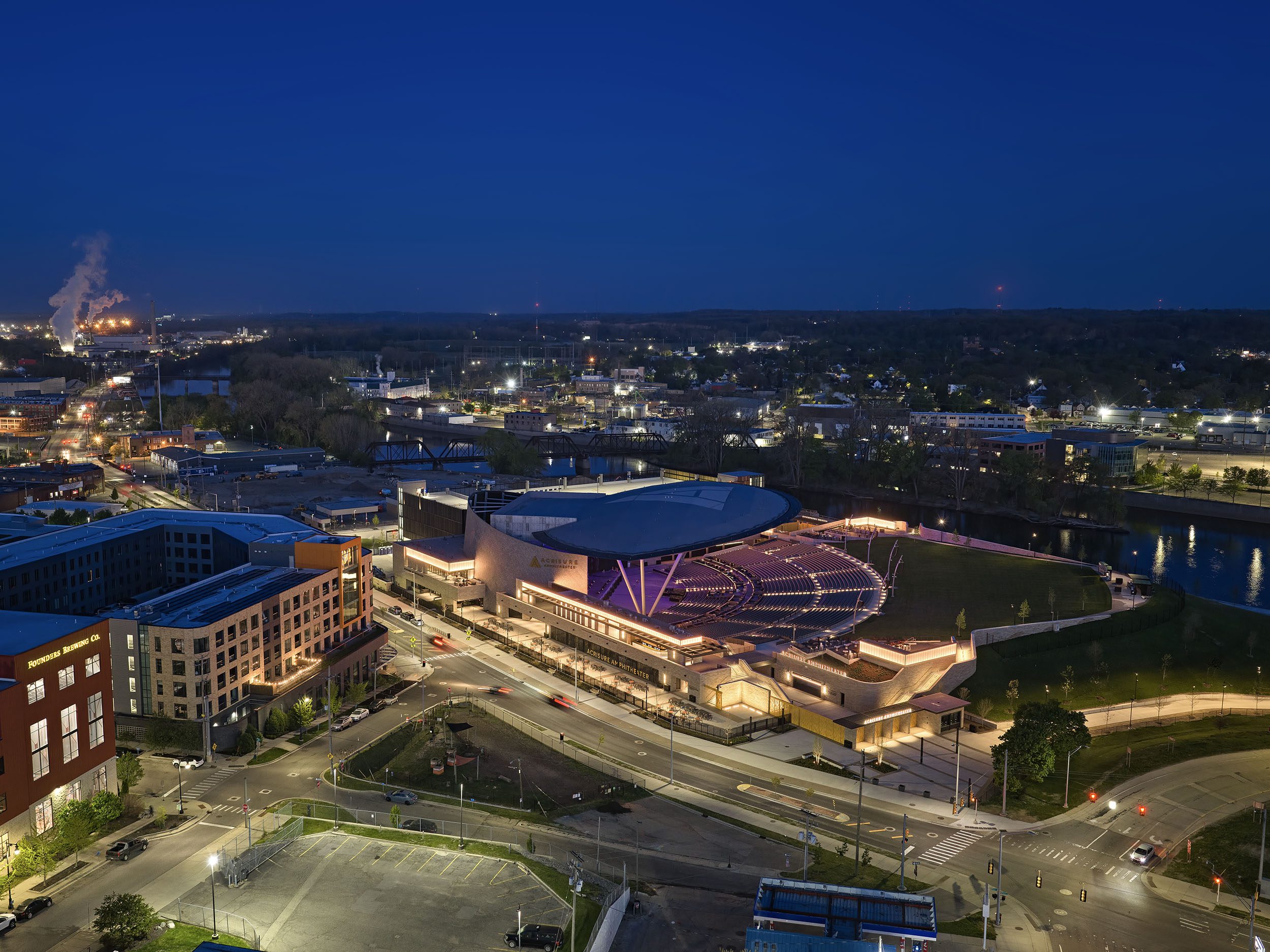 Aerial view at night of the Acrisure Amphitheater in Grand Rapids, Michigan.