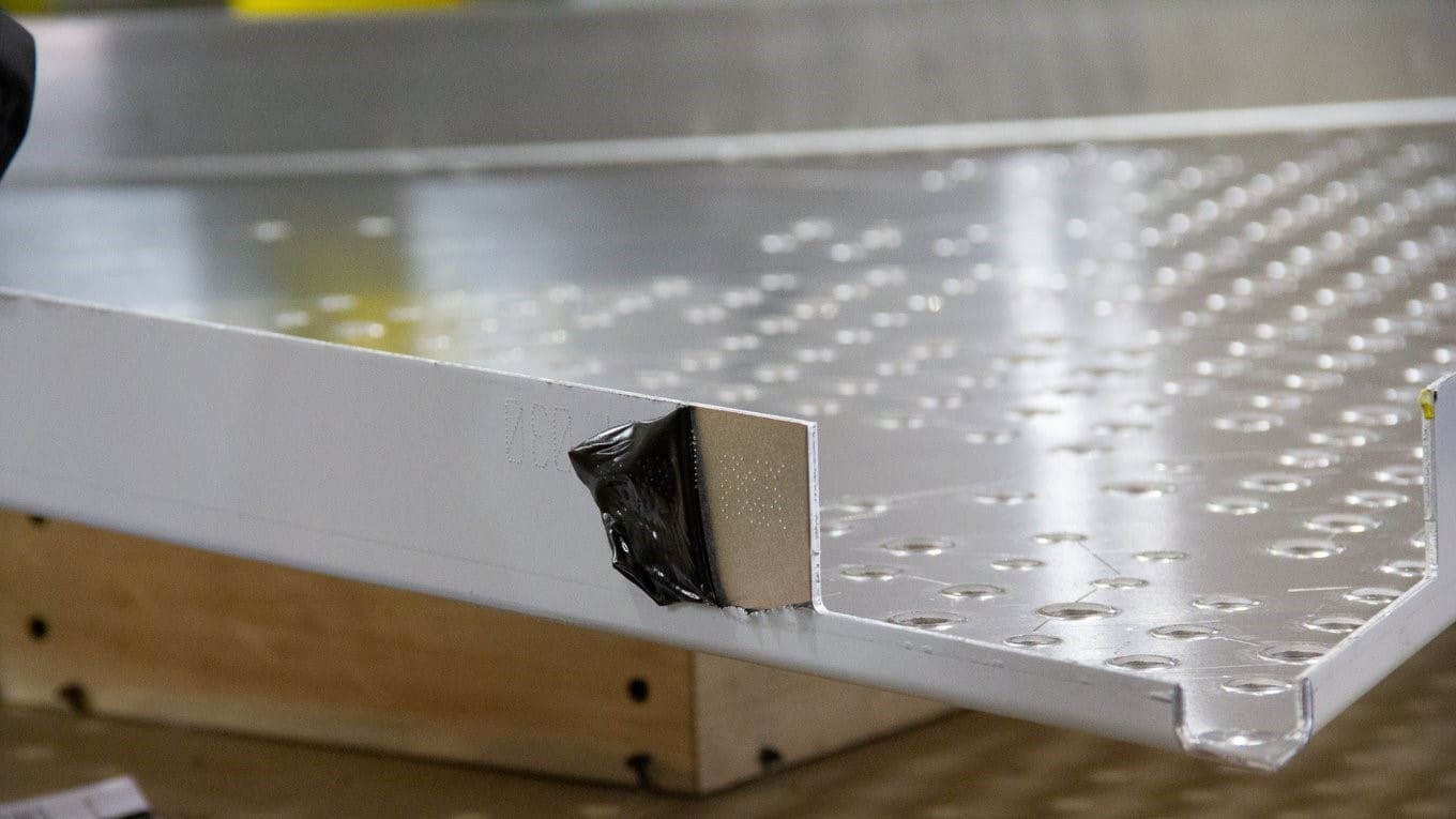 Closeup of the inscribed "dot code" used to track the panel through the fabrication, shipping, and installation processes.