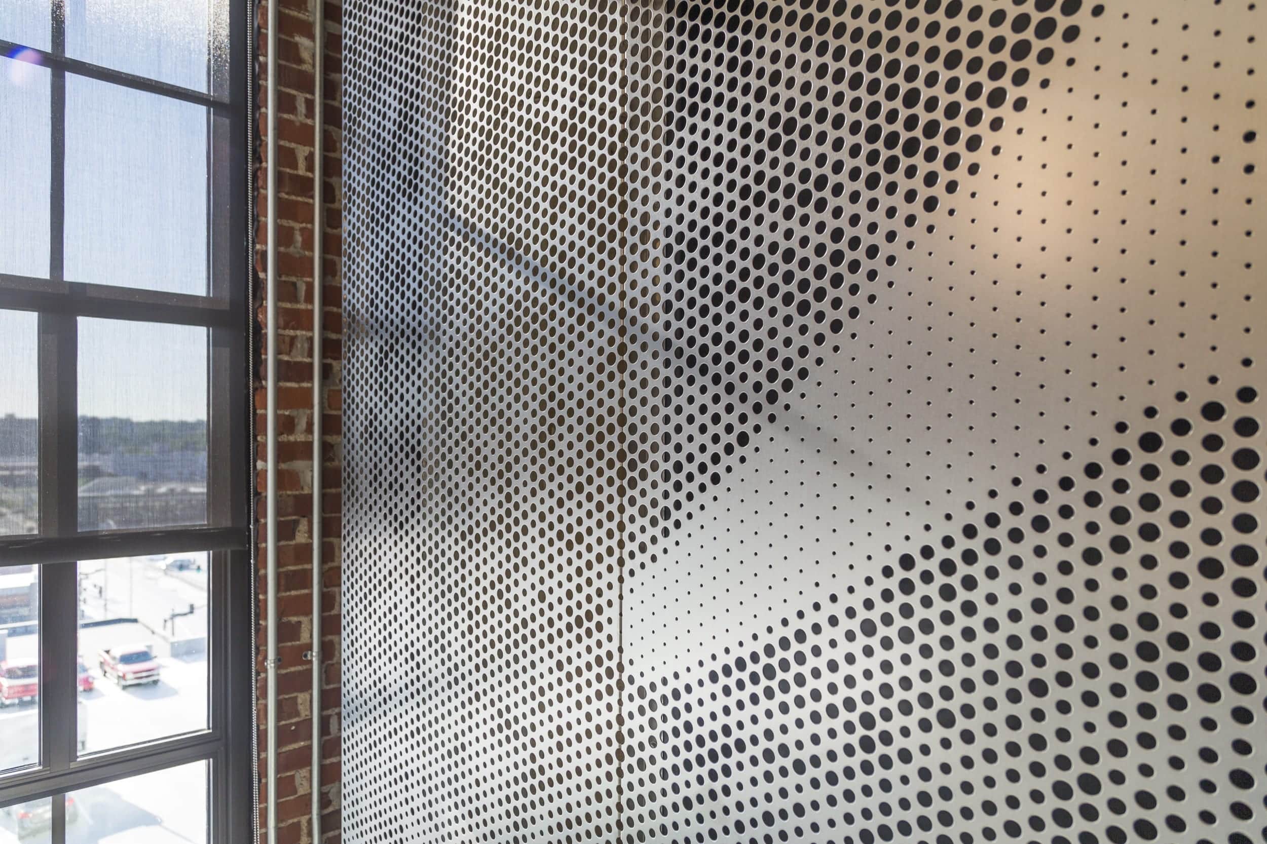 Detail of free-standing screen in Angel Hair Stainless Steel with a painted aluminum backing.