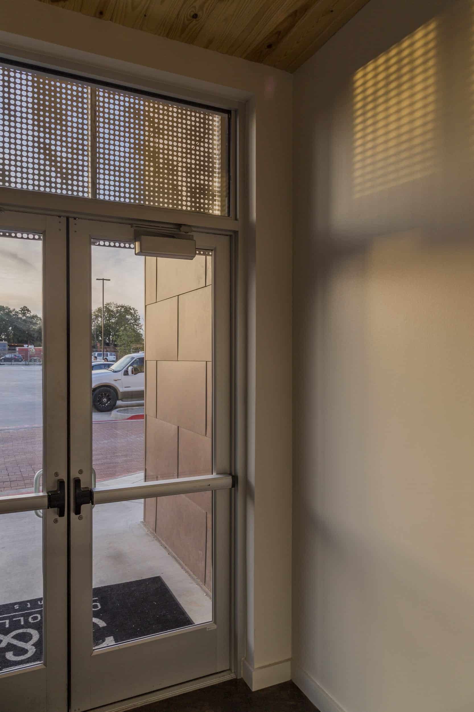 Interior of restaurant viewing ImageWall screen in angel hair stainless steel.