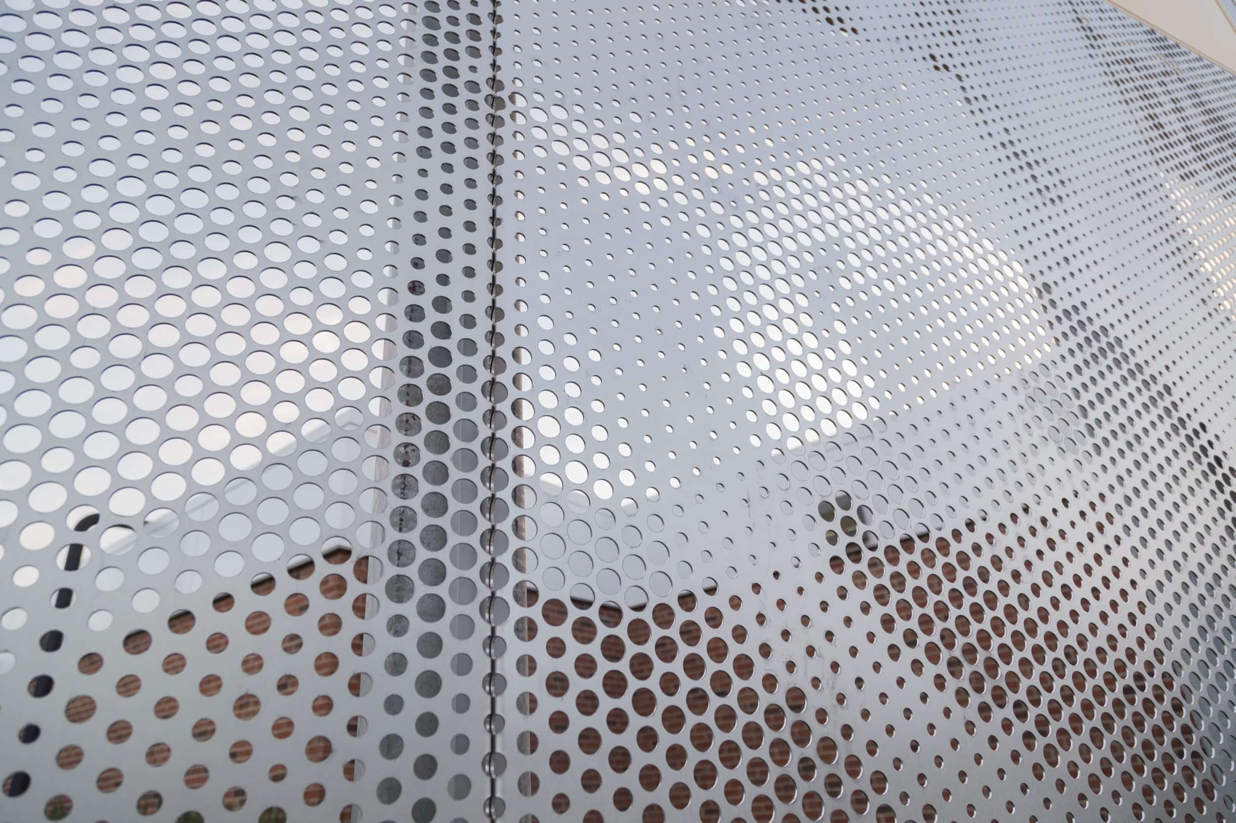 Angel hair stainless steel screens depicting the school's mascot.