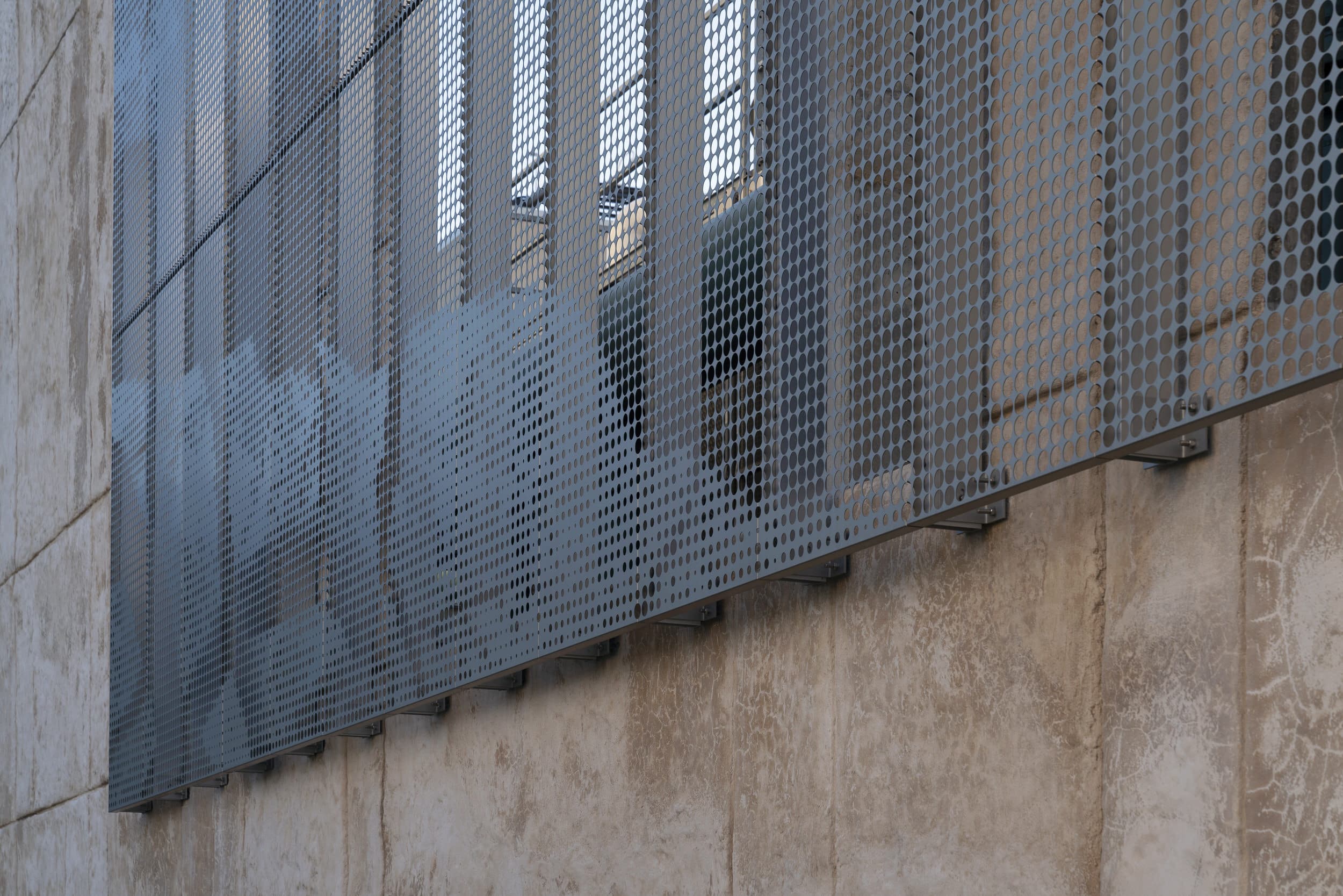 Zahner's Drop & Lock™ panel hardware was used for mounting the perforated ImageWall panels.